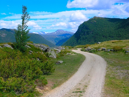 Road passing by the lakes at the norwegian mountains の写真素材