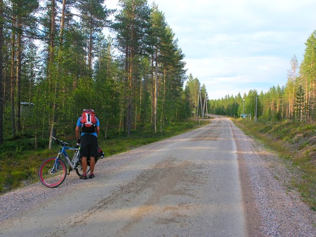 Cyclists on the roads in Finland sunny day の写真素材