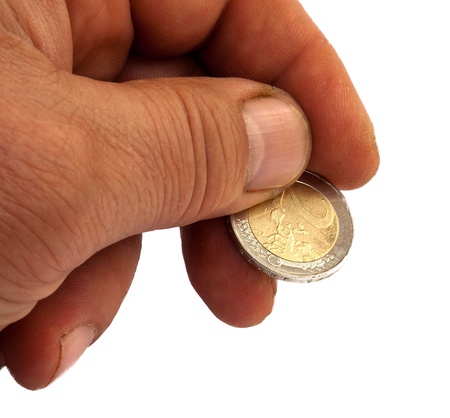 Hand the old man with a two euro-coin isolated on white の写真素材
