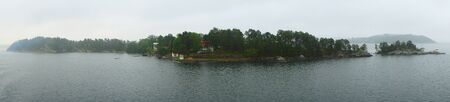 Panorama Swedish coast  in a morning fog . Sunriseの写真素材