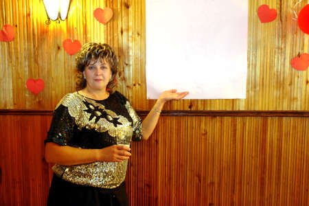 A beautiful middle-aged woman near blank white canvas                           の写真素材