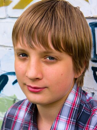 Portrait of a handsome young guy in a  shirtの写真素材
