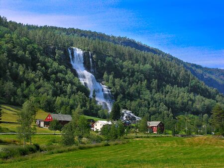 Houses near the lake in the mountains of Norwayの写真素材