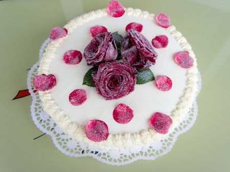 Birthdays, Valentines and anniversaries - festive cake with red roses の写真素材