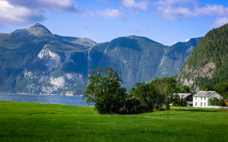Travelling to Norway. Mountains, rivers, lakes, fjords and valleys. Mountain villageの写真素材