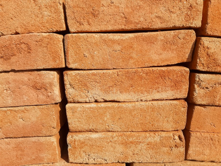 close-up portrait of neatly arranged bricks ready to be used as building materials