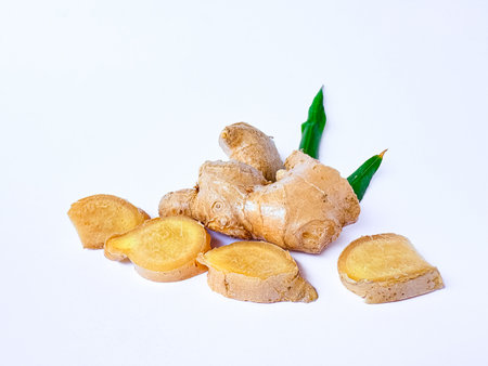 Close up of Fresh ginger and sliced ââginger isolated on white backgroundの写真素材