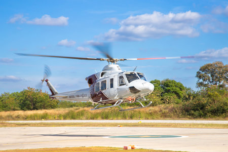 Nakhon Ratchasima, Thailand - DEC, 2021 : Thai Police Aviation Division Bell 412EPI Helicopter Landing at Central Training Center Nong Sarai.のeditorial素材