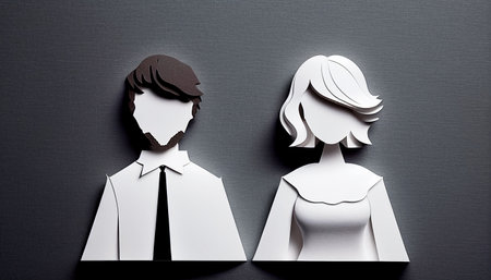 Paper cut of a man and a woman on a black background.の素材