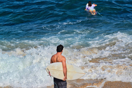 surfer looking at ocean