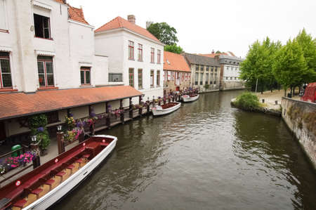 boat and restaurants, located on a canal in Amsterdamの写真素材