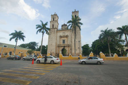 Catholic Church of San Servacio, in Valladolid Mexico, you can see part of the street and part of the park in addition to some carsのeditorial素材