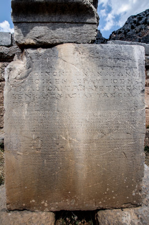 Monolith in Delphi where Greek writing of the time is foundの写真素材