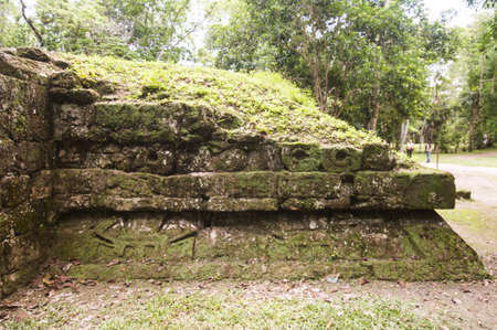 Mayan structures in Chichen Itza where you can see the pyramid and some symbols, this on a sunny dayの写真素材
