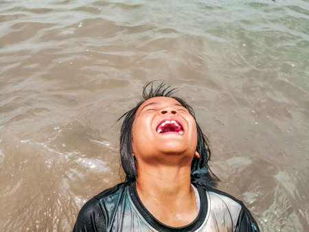 Chaiyaphum, Thailand- May 20,2020:Happy girl having fun on summer vacation.のeditorial素材