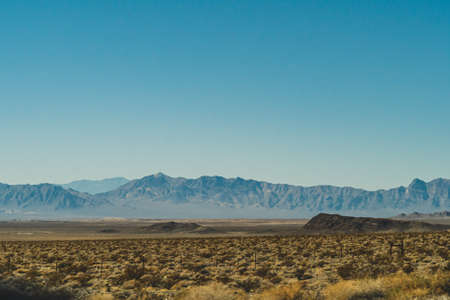 Arid Mountains landscape against clear blue sky in Nevadaの写真素材