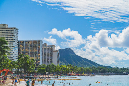 Oahu Hawaii people enjoying Waikiki beach with Diamond Head in backgroundのeditorial素材
