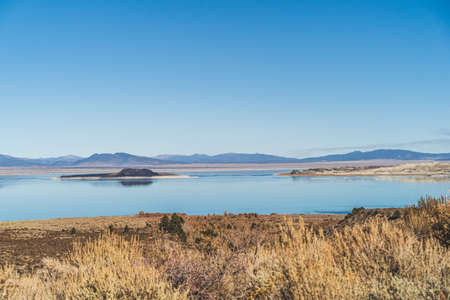 Mono lake, California in Autumn on sunny day with clear blue sky and tufaの写真素材