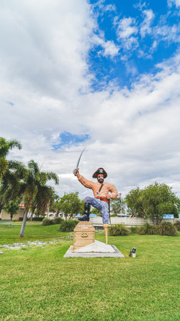 Pirate Statue standing on treasure chest with sword raised to the skyのeditorial素材