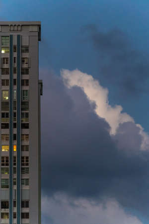 High-rise condominiums against dramatic skyの写真素材