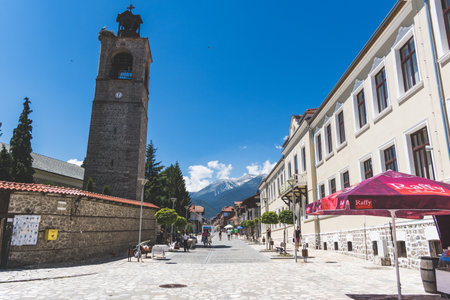 Pirin Street Bansko Bulgaria with view of Todorka Peakのeditorial素材
