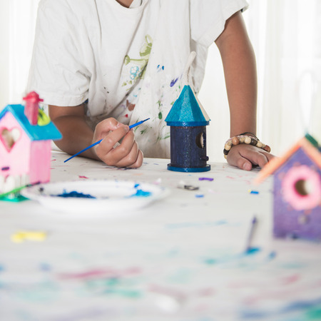 Teenager Working on Art Project, Painting, Designing, Colourful Birdhousesの写真素材