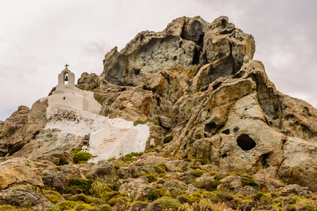 Traditional Greek chapel on a high cliff, Naxos island, Cyclades, Greece.の写真素材