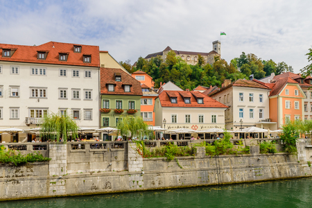 Ljubljana, Slovenia - September 10, 2016: a view of the picturesque embankment of the Ljubljanica river and Ljubljana castle.のeditorial素材
