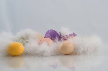 Easter eggs with feathers and sparkly purple egg