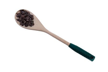 Coffee beans on wooden spoon isolated on white backgroundの写真素材