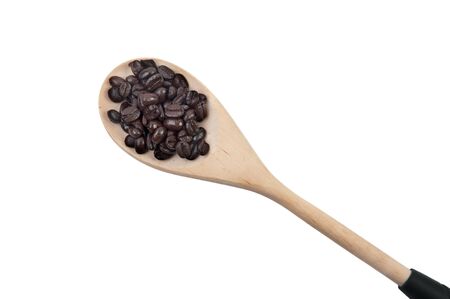 Coffee beans on wooden spoon isolated on white backgroundの写真素材