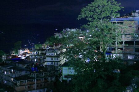 Gangtok Cityscape at night and houses over the mountainsの写真素材
