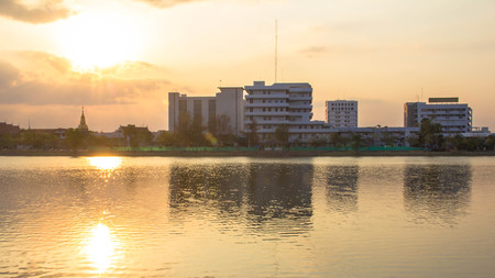 Photos Building River Town In Udon Thani, Thailand golden sky background. Sun during sunsetのeditorial素材