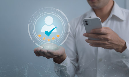Customer service and Satisfaction concept ,Business people are touching the virtual screen on the happy Smiley face icon to give satisfaction in service. rating very impressed.の写真素材