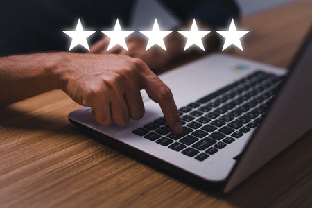 Customer service satisfaction survey concept.Business people or customers show satisfaction through the application on the tablet screen. By giving the most satisfaction rating and 5 stars.の写真素材