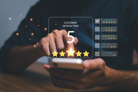 Customer service satisfaction survey concept.Business people or customers show satisfaction through the application on the tablet screen. By giving the most satisfaction rating and 5 stars.の写真素材