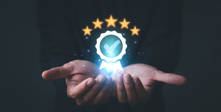 Service Quality assurance. Hand shows the sign of the top service Quality assurance 5 star,...