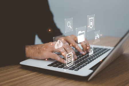 Document Management System (DMS) Online Document Database . business man using laptop access files document on viritual screen, document management systemの写真素材