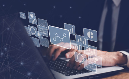 Big data analytics and business intelligence concept with chart and graph icons on a digital screen interface. businessman use laptop.の写真素材