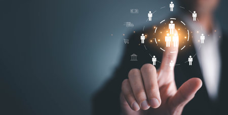 Businessman tuching human icon for business CRM or Customer Relation Management and customer focus target group concept, social media. Digital marketing online. HRM, human manage.の写真素材