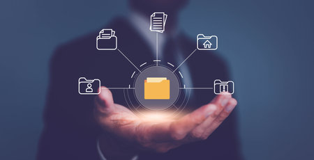 Businessman kolding folder and document icon and manage files online document database, Document management system concept.の写真素材