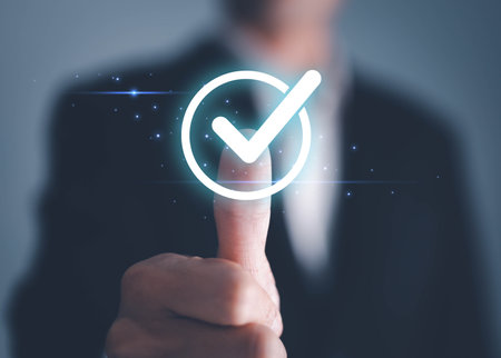 Businessman hand thumb up with virtual correct sign or tick mark for approve quality assurance and...
