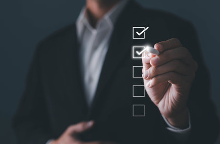 Businessman touching to tick correct sign mark in checkbox for quality document control checklist...