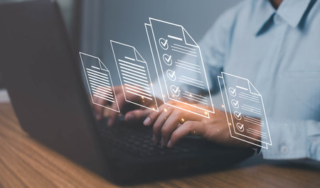 Document management concept, Business man use laptop management electronic documents online. document management in a modern document storage system.の写真素材