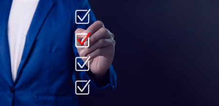 Business performance checklist, businessman using laptop doing online checklist survey, filling out digital form checklist, take an assessment, questionnaire, evaluation, online survey, online exam.の写真素材