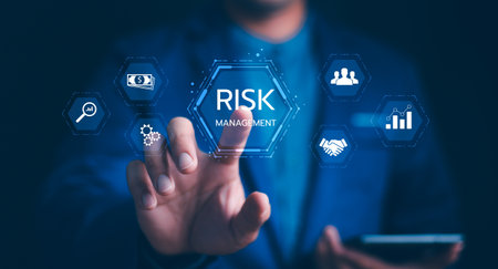Risk Management: Navigating future business challenges with strategic solutions. Businessman with a digital risk assessment, financial protection, data analysis, for business continuity and security.の写真素材