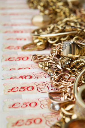 Golden jewelry on British Poundsの写真素材
