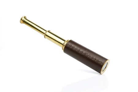 Antique brass telescope on white の写真素材