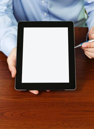 Businessman Presenting Your Text At Digital Tablet With Clipping Path For The Screenの写真素材
