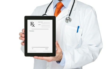 Doctor holding digital tablet with prescription on itの写真素材
